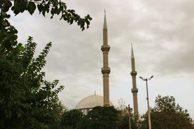 View of bell tower against cloudy sky