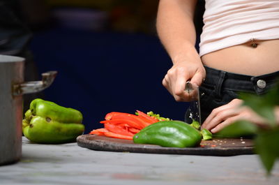 Midsection of woman with fruits