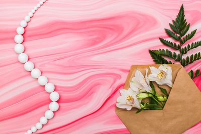 High angle view of pink flower on table