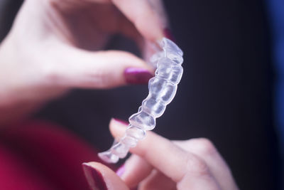 Close-up of hand holding mouthguard