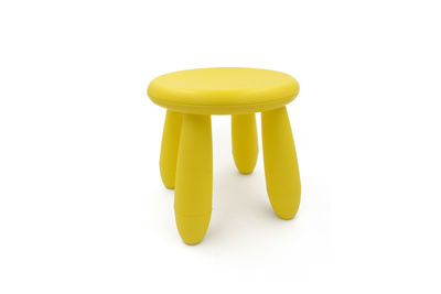 Close-up of yellow toy over white background