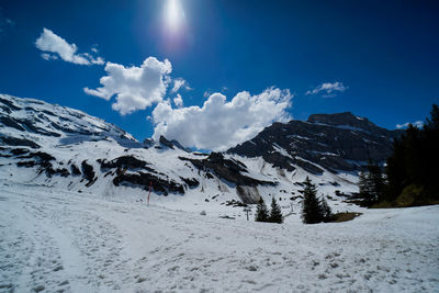 Snow covered mountains against sky