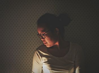 Young woman sitting in eyeglasses