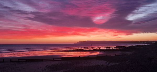 Scenic view of sea against sky during sunset