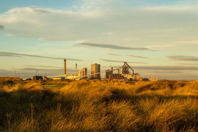 Scenic view of field against sky during sunset