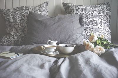 Coffee and food on bed