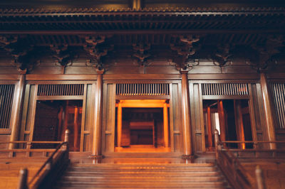 Low angle view of empty corridor in building