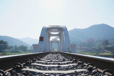 Railroad track against clear sky