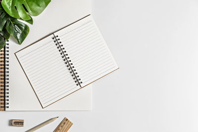 Low angle view of pen on table against white background