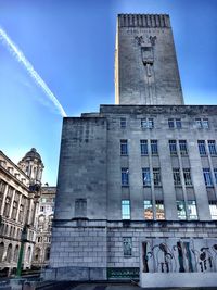 Low angle view of historical building against blue sky