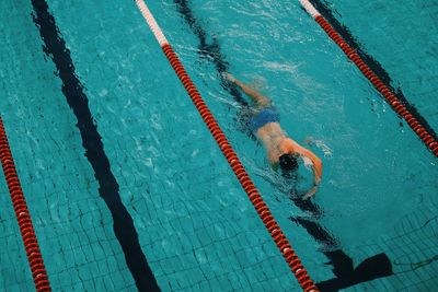 High angle view of man swimming in sea