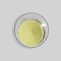 Directly above shot of yellow drink against white background