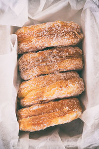 Directly above shot of donuts in container