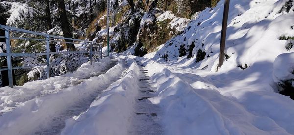 Scenic view of snow covered land and mountains