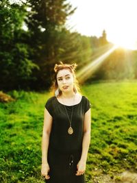 Woman standing on field against sky