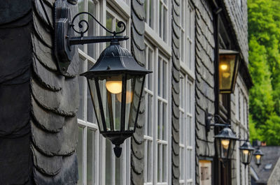 Facade in the old town with slate, white window frames and lanterns