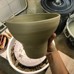 Close-up of hands working in bowl