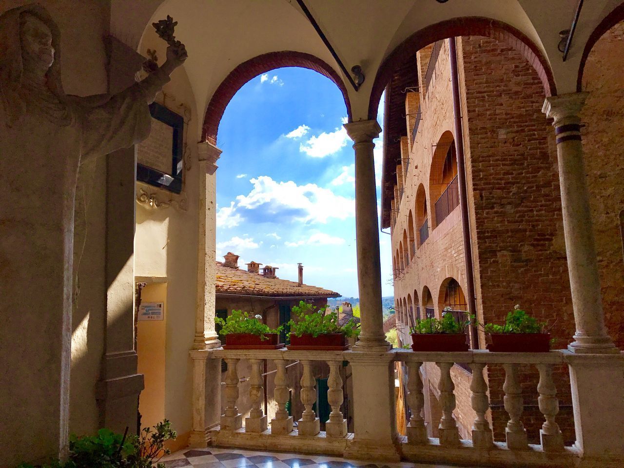 BUILDINGS SEEN THROUGH ARCH WINDOW
