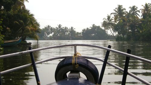 Boat sailing in sea against clear sky