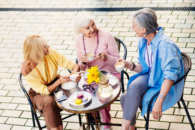 Group of people sitting on chairs