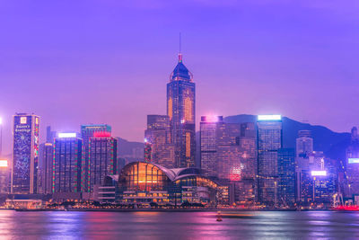 Illuminated city at waterfront