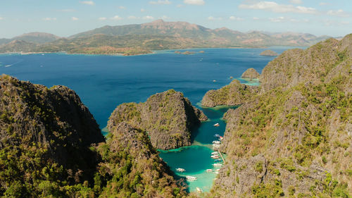 Lagoons and coves with blue water among the rocks. lagoon, kayangan covered with forests