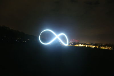 Light painting against sky at night