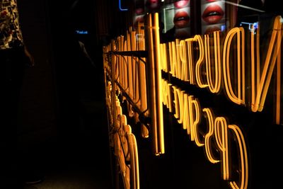 Close-up of illuminated lights in the dark