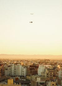 Aerial view of cityscape against clear sky