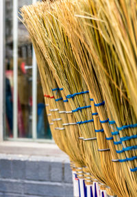 Brooms in row for sale