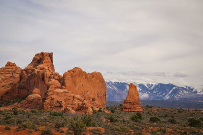 Rock formations on landscape against sky