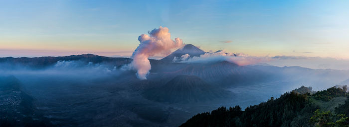 Panoramic view of mountains against sky during foggy weather