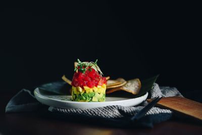 Close-up of fruits in plate on table