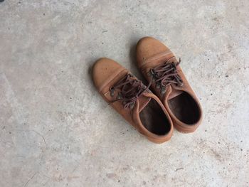 High angle view of brown shoes on floor