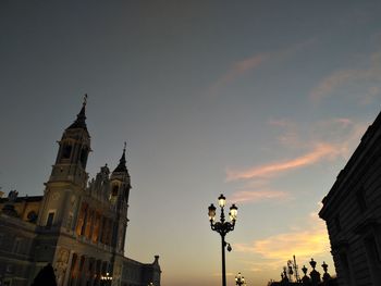 Low angle view of buildings against sky during sunset