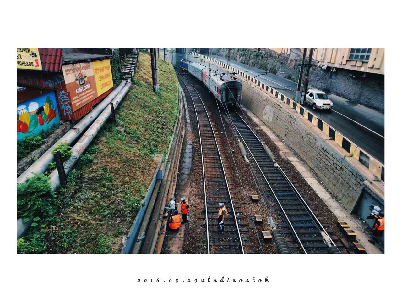 HIGH ANGLE VIEW OF TRAIN ON RAILROAD STATION PLATFORM