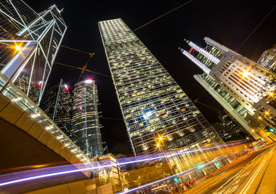 Low angle view of illuminated city at night