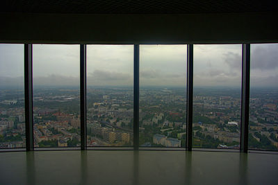 High angle view of buildings seen through window