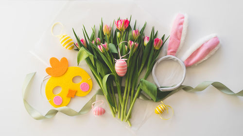 Happy easter. stylish dyed easter eggs with spring flowers