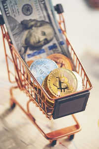 Close-up of bitcoin in shopping cart