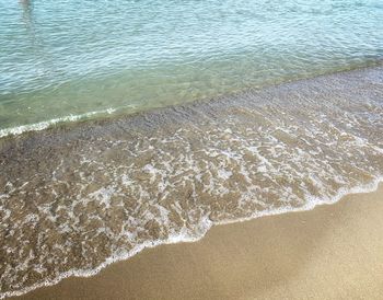 High angle view of surf on beach