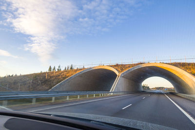 Animal overpass on highways of finland. bridge for passage of animals on way . arch over road.