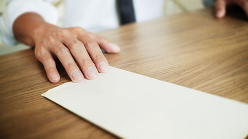Close-up of man working on table