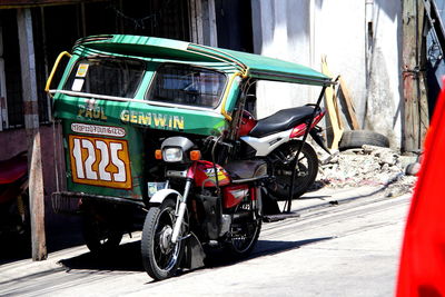 Jinrikisha parked on city street