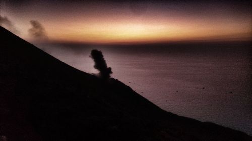 Scenic view of sea against sky at sunset
