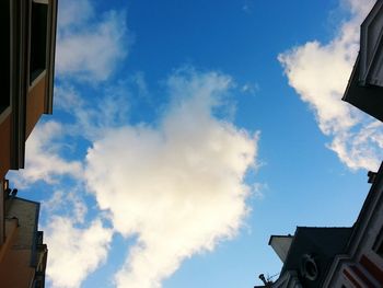 Low angle view of building against cloudy sky