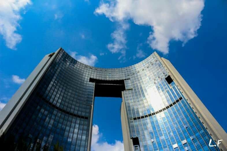 architecture, building exterior, built structure, low angle view, modern, office building, skyscraper, city, sky, tall - high, blue, tower, reflection, glass - material, building, cloud - sky, cloud, day, outdoors, window