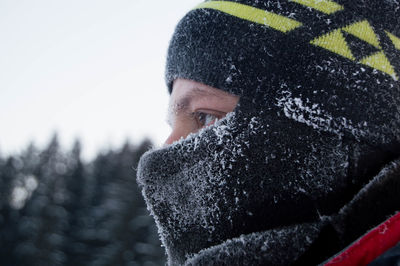 Close-up portrait of man in snow