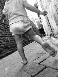 Low section of woman walking outdoors