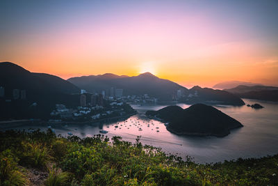 Scenic view of mountains against sunrise sky